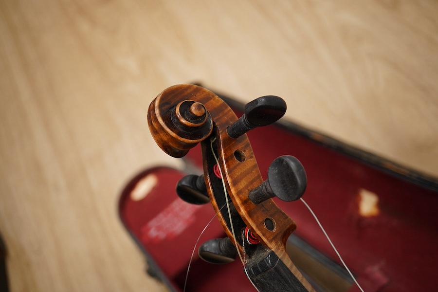 Two cased violins; one French 19th century bearing a hand written label for Francesco Werentle 1746, body length 35.5cm, the other an early 20th century violin, body length 35cm. Condition - poor.